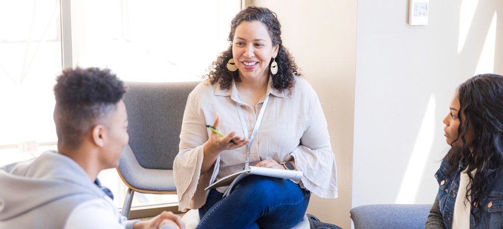 Counselor talking to young couple
