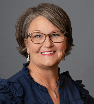 Angie Haustein, a female professor, looking at the camera.