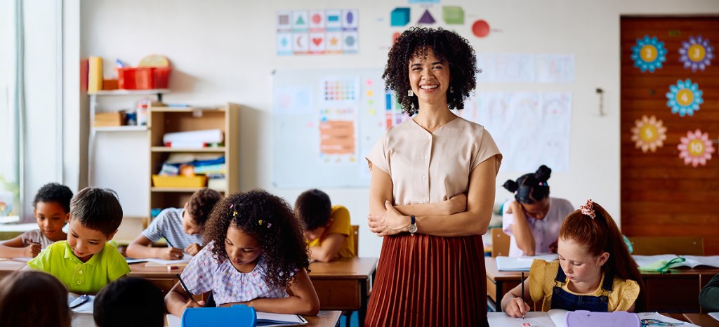 teacher with K-12 classroom